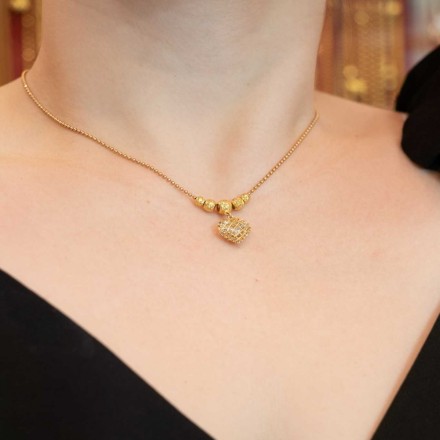 สร้อยคอพร้อมจี้ 2สลึง.ไข่ปลาคั่นเม็ดกลมห้อยจี้หัวใจฉลุสองสี